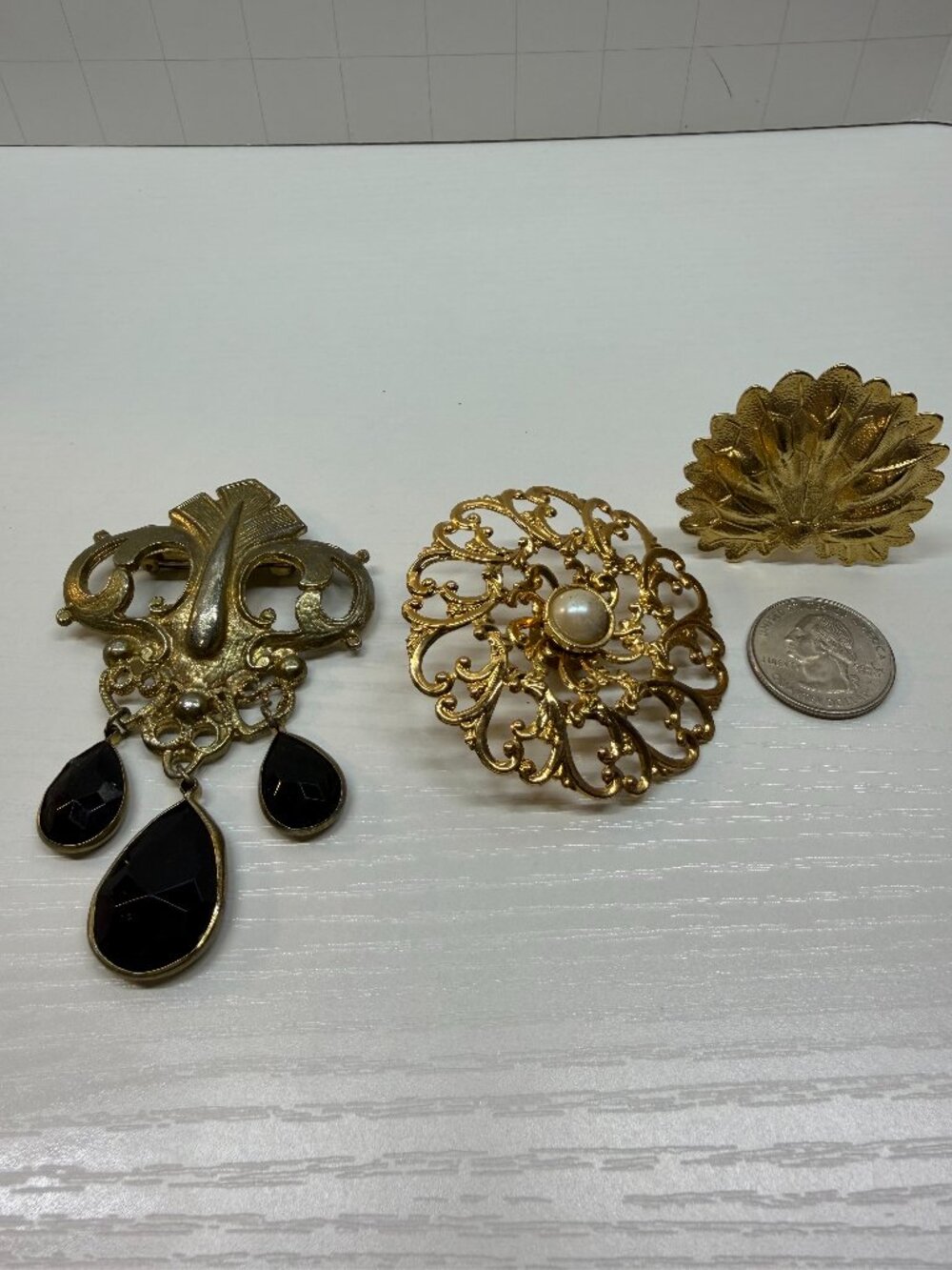 Vintage light weight jewelry pieces 2 are pins 1 is a scarf clip
